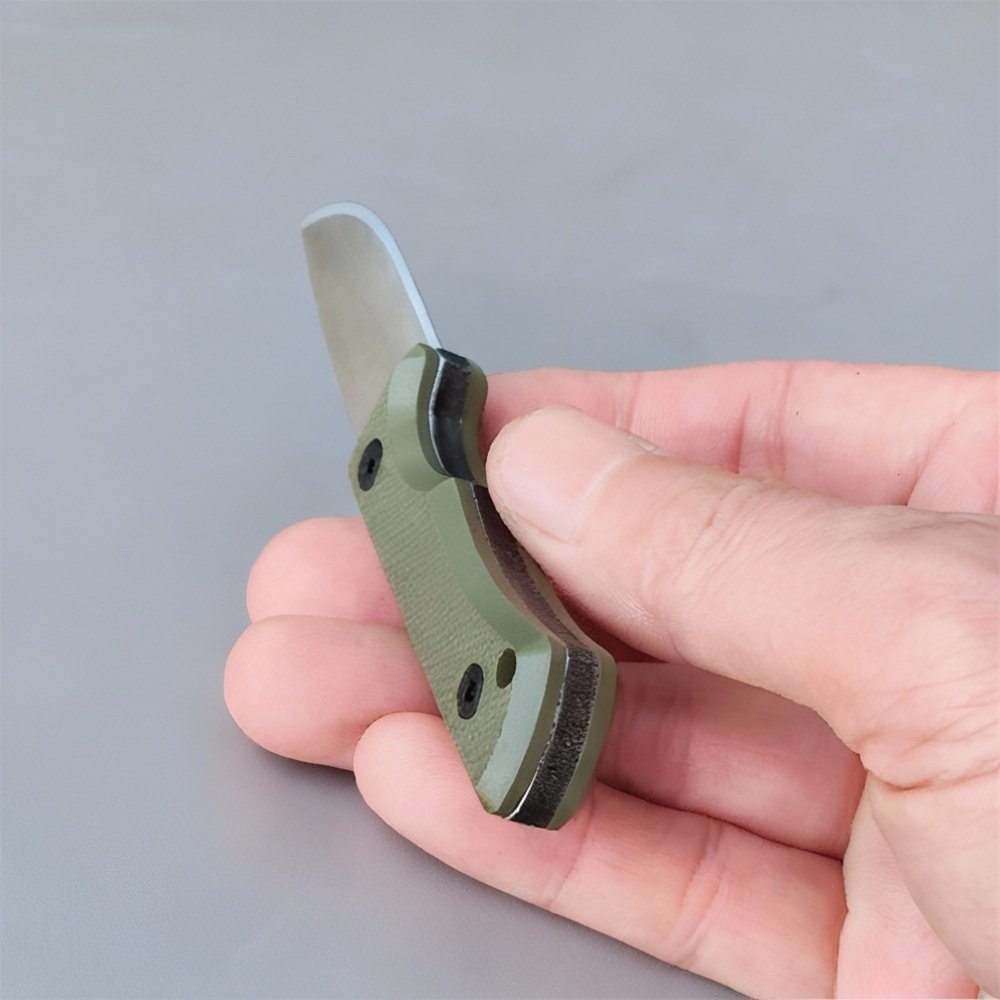EDC fixed blade knife blade detail with compact thermoplastic sheath