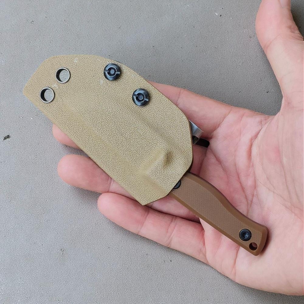 EDC fixed blade knife with compact thermoplastic sheath shown in hand